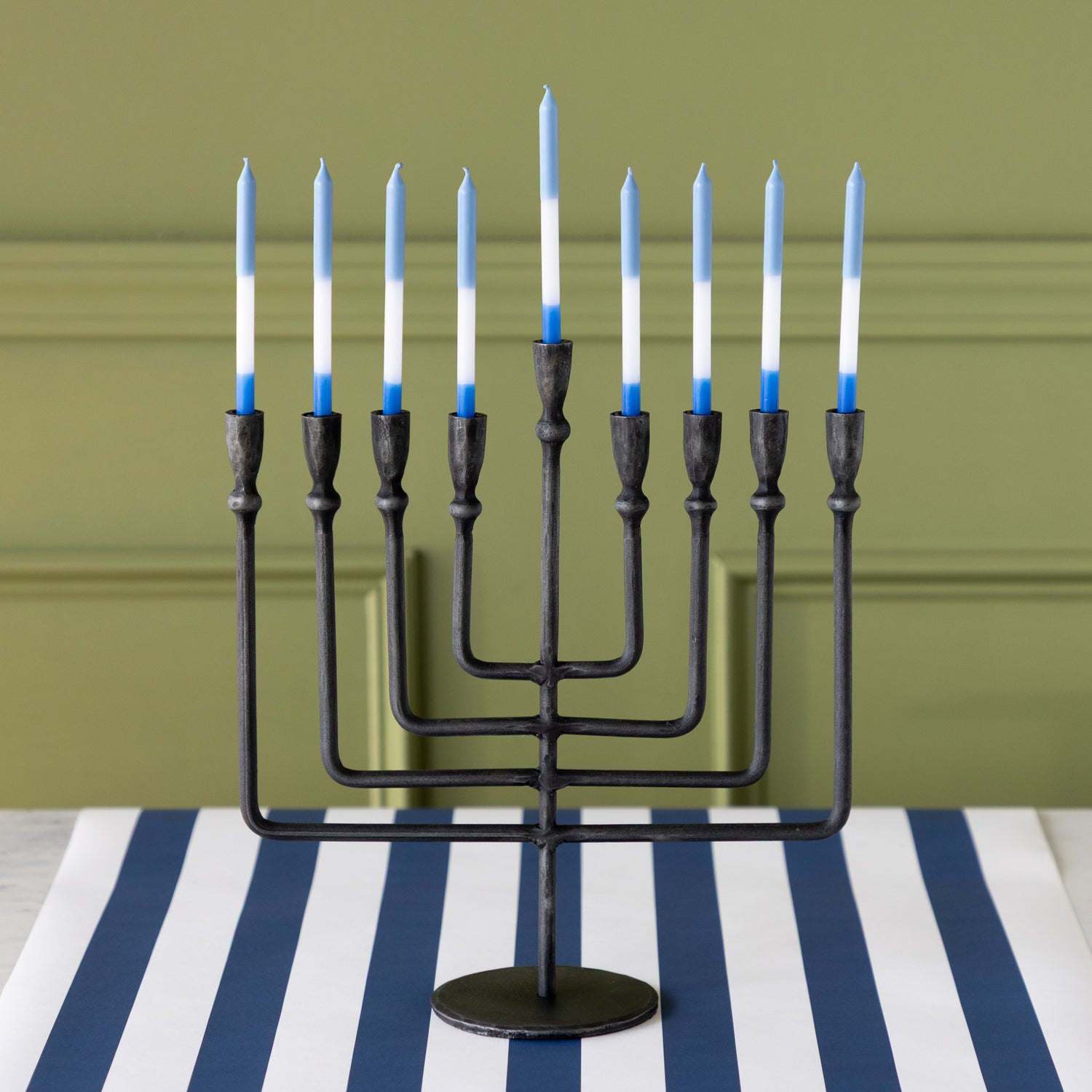Liora Menorah with blue and white menorah candles on the Navy Classic Stripe Runner.