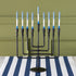 Liora Menorah with blue and white menorah candles on the Navy Classic Stripe Runner.