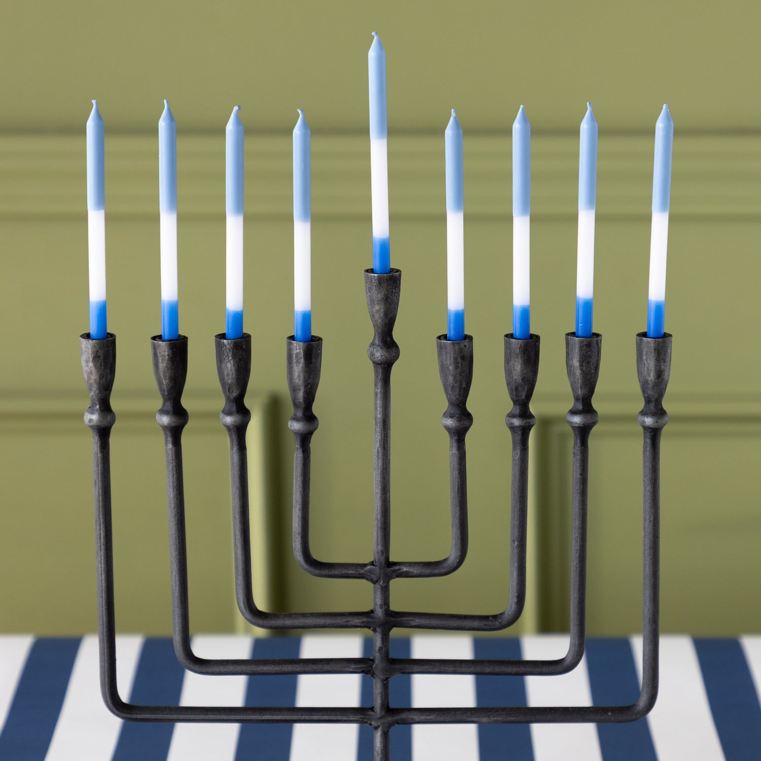 Liora Menorah with blue and white menorah candles on the Navy Classic Stripe Runner.