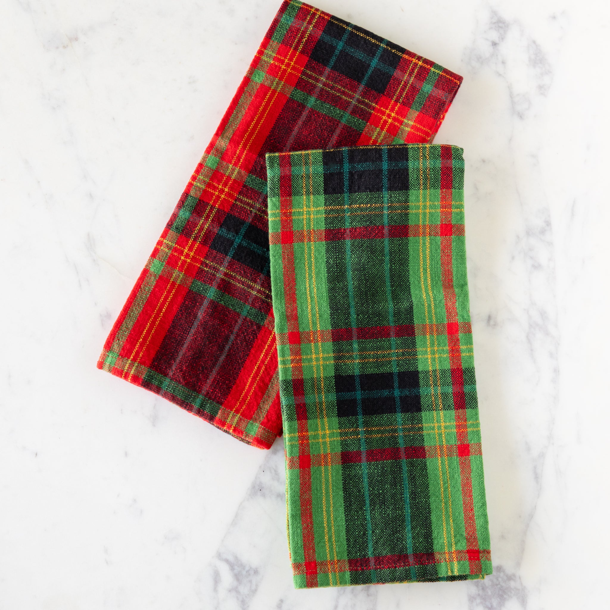 Holiday Plaid Dish Towels arranged on a table.