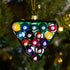 Decorative ornament shaped like a pool ball triangle on a Christmas tree.