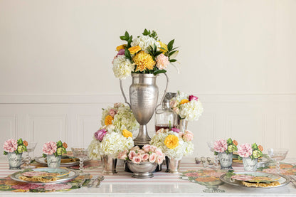 The Garden Cascade Placemat in an elegant table setting for four, featuring a silver trophy in the floral centerpiece.