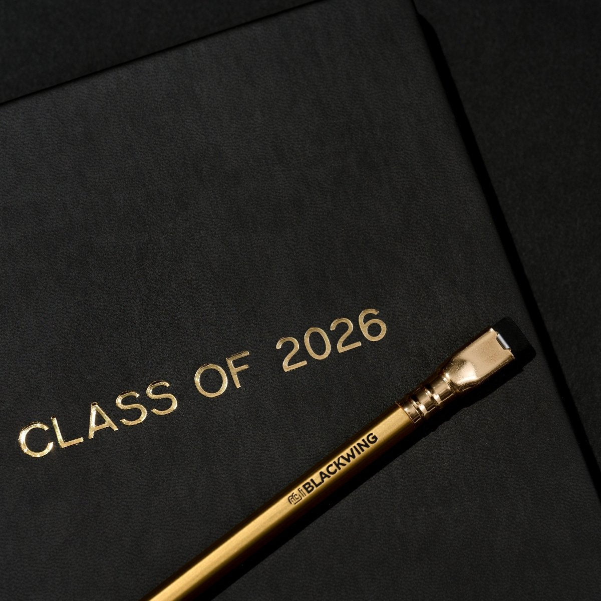 Black notebook with &
