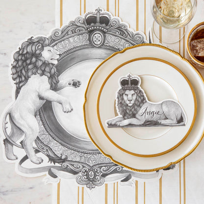 Die-cut H&amp;C Regal Crest Placemat on the Antique Gold Stripe Runner, styled elegantly with the Regal Lion Place Card, on a table setting for one.