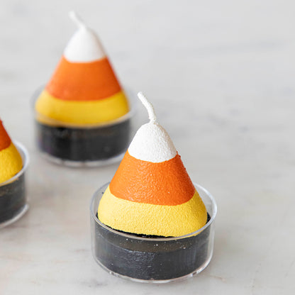 Candy corn theme tea light on a marble table/.