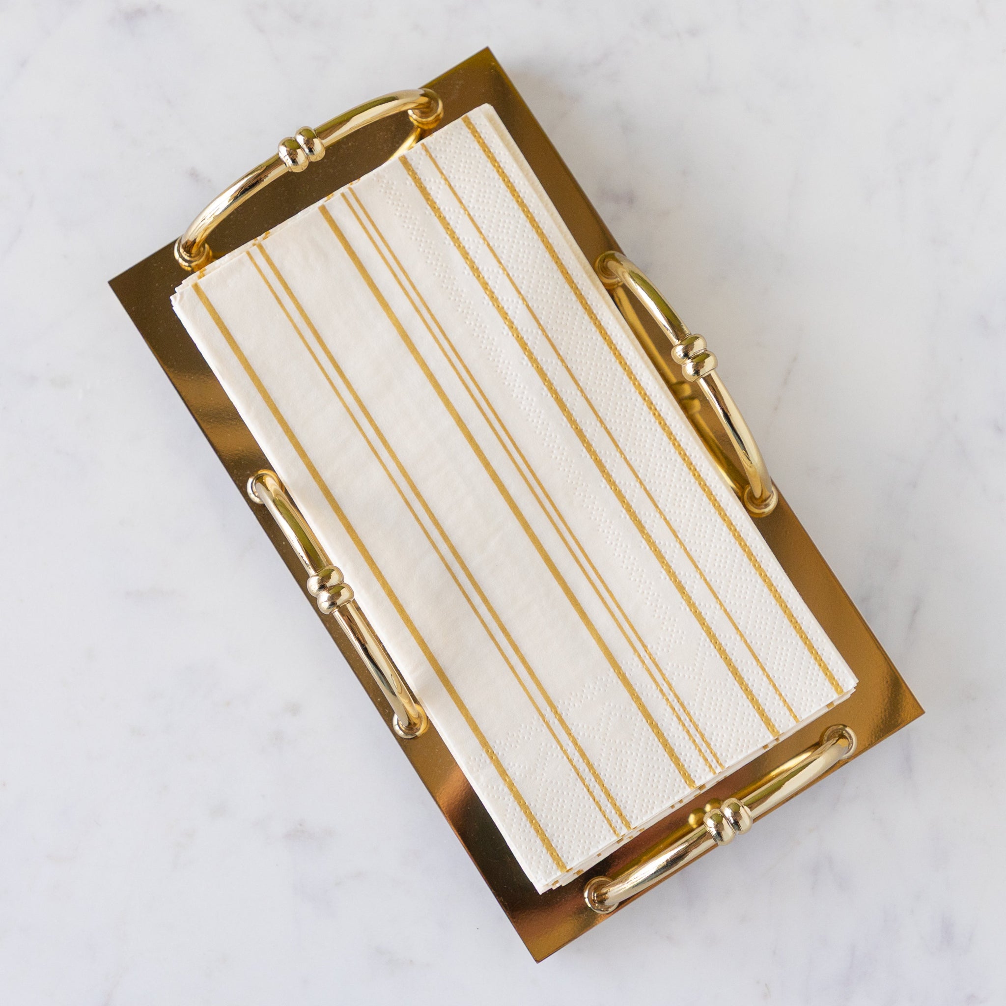 Gold Scalloped Napkin Holder in the guest size with Antique Gold Stripe Guest Napkins in them.