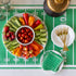 Marble Chip and Dip Server with fruits and veggies atop, Touchdown Cocktail Napkins, a gold trophy, and glasses, plates and forks on the Touchdown Runner.