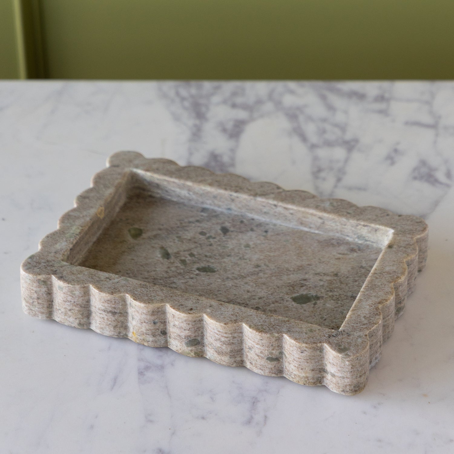 Small Intricate Scallop Marble Tray on a marble surface.