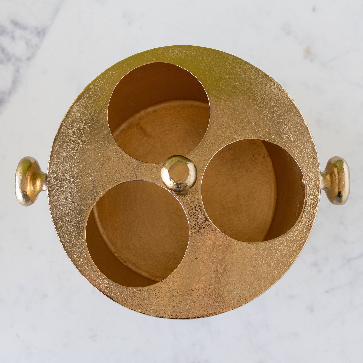 Gold Raw Aluminum Bottle Holder with three holes for wine bottles.