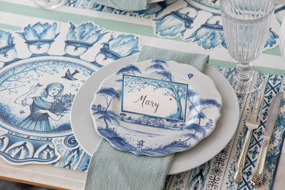 A plate adorned with Indigo Meadow Place Cards, making guests feel extra special. (Brand: Hester &amp; Cook)