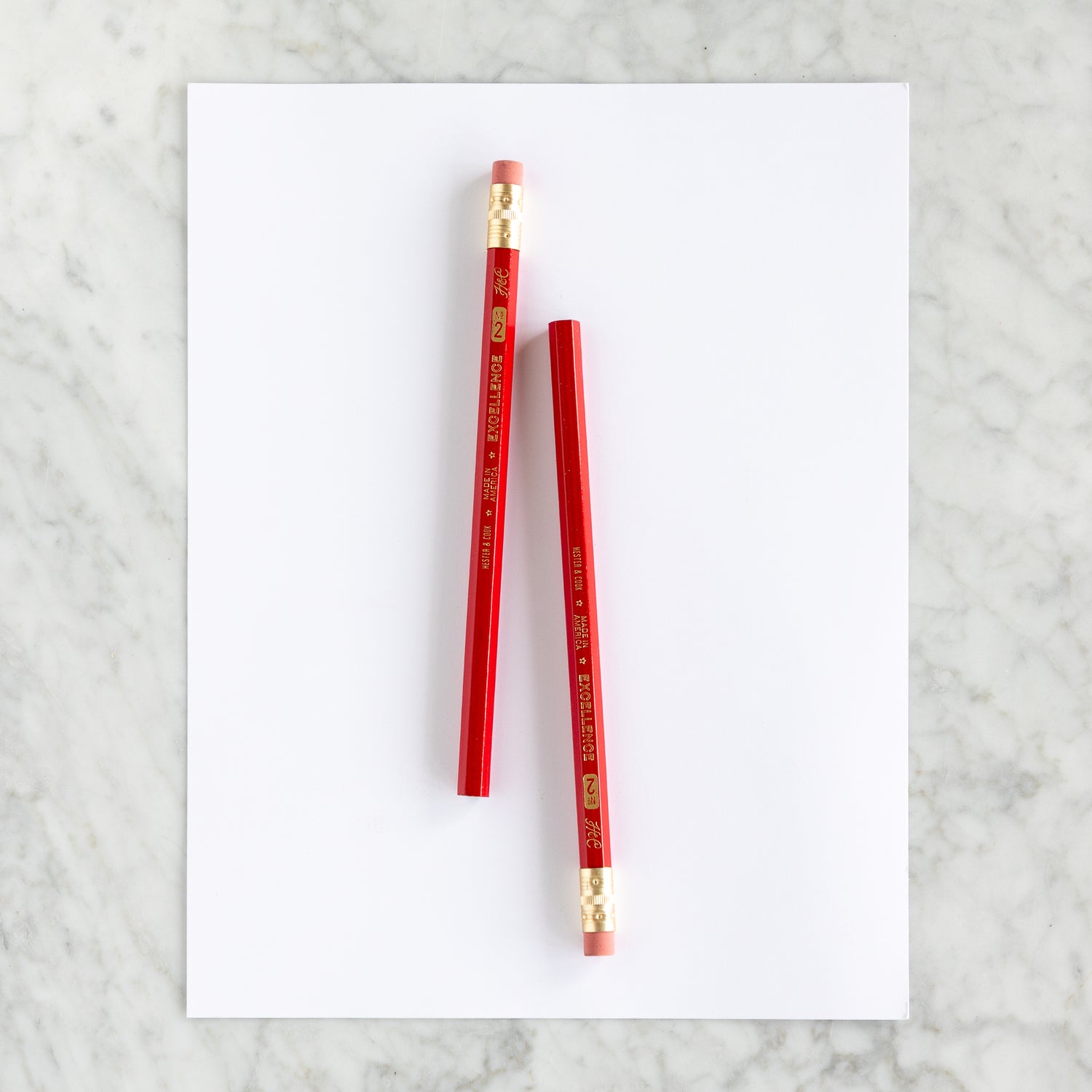 Two Jumbo Hex Red Pencils on a piece of paper. 