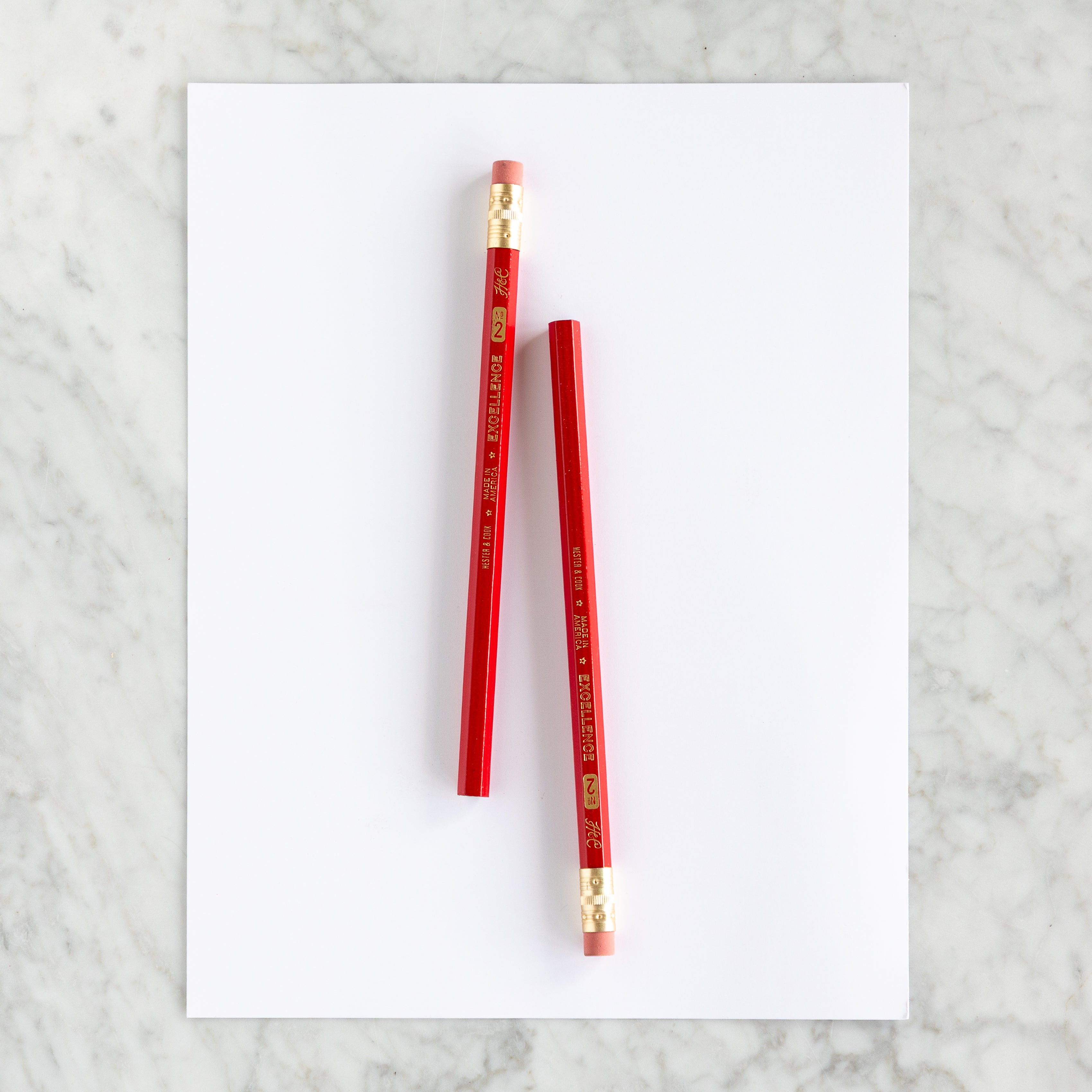 Two Jumbo Hex Red Pencils on a piece of paper. 
