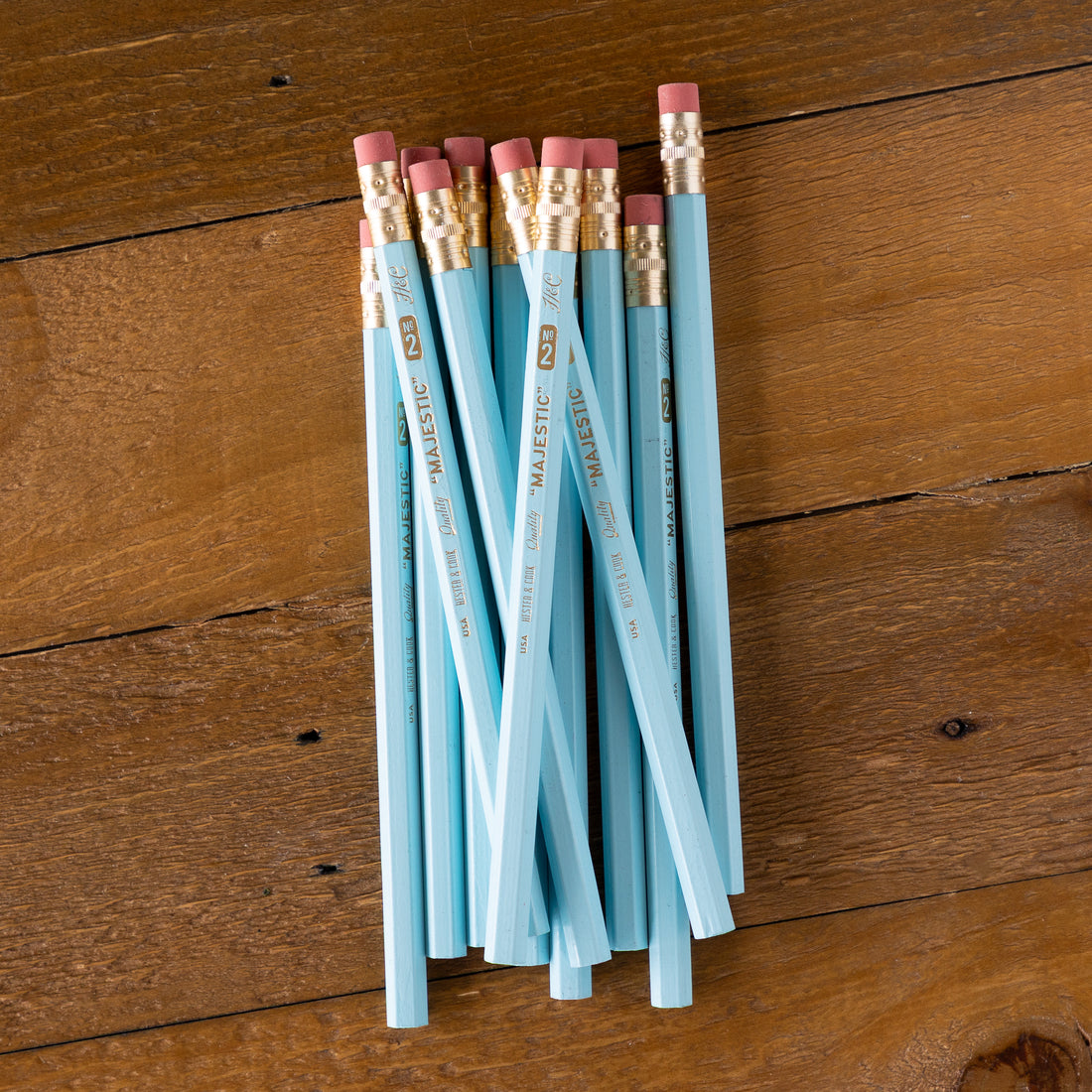 Pastel Blue Jumbo Hex Pencils grouped together on a wood background. 