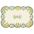 A die-cut placemat with symmetrical, rounded, bumpy edges containing an outline of of various leafy green sprigs on a white background, with a decorative sprig design in the center.