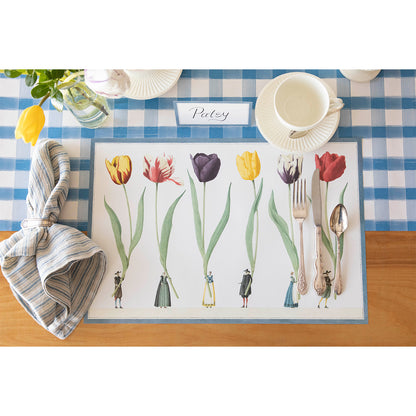The Tulip Parade Placemat under an elegant place setting sans plate, from above.
