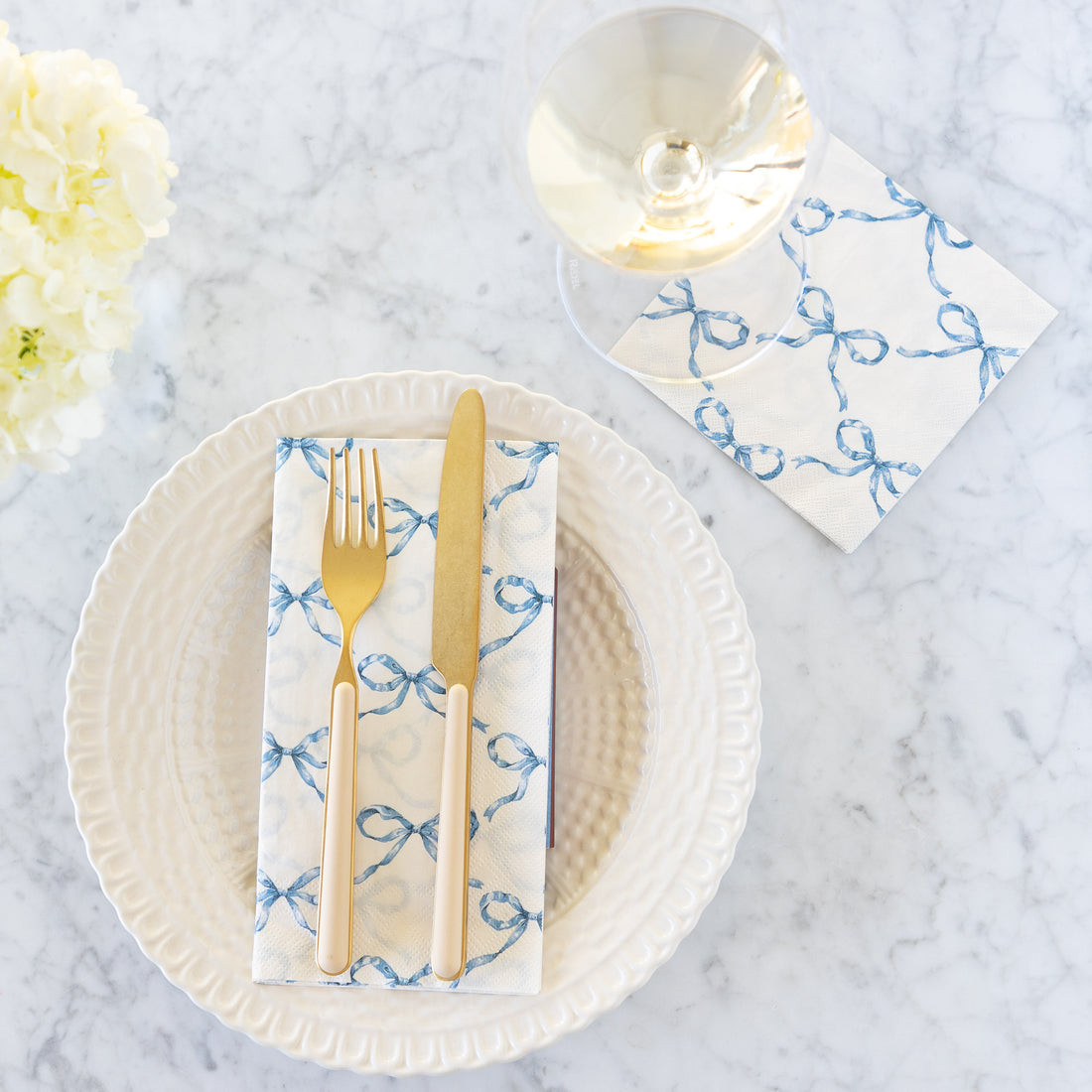 Heirloom Blue Bow Lattice Cocktail and Guest Napkins on a table setting.