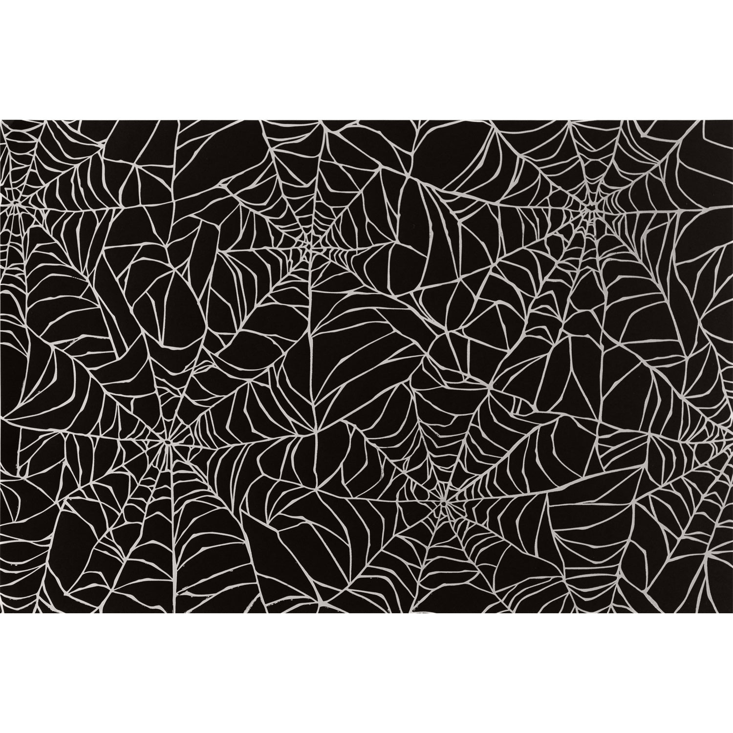 Spiderweb Placemat by Hester &amp; Cook featuring an overlapping spiderweb pattern in silver with a black background.