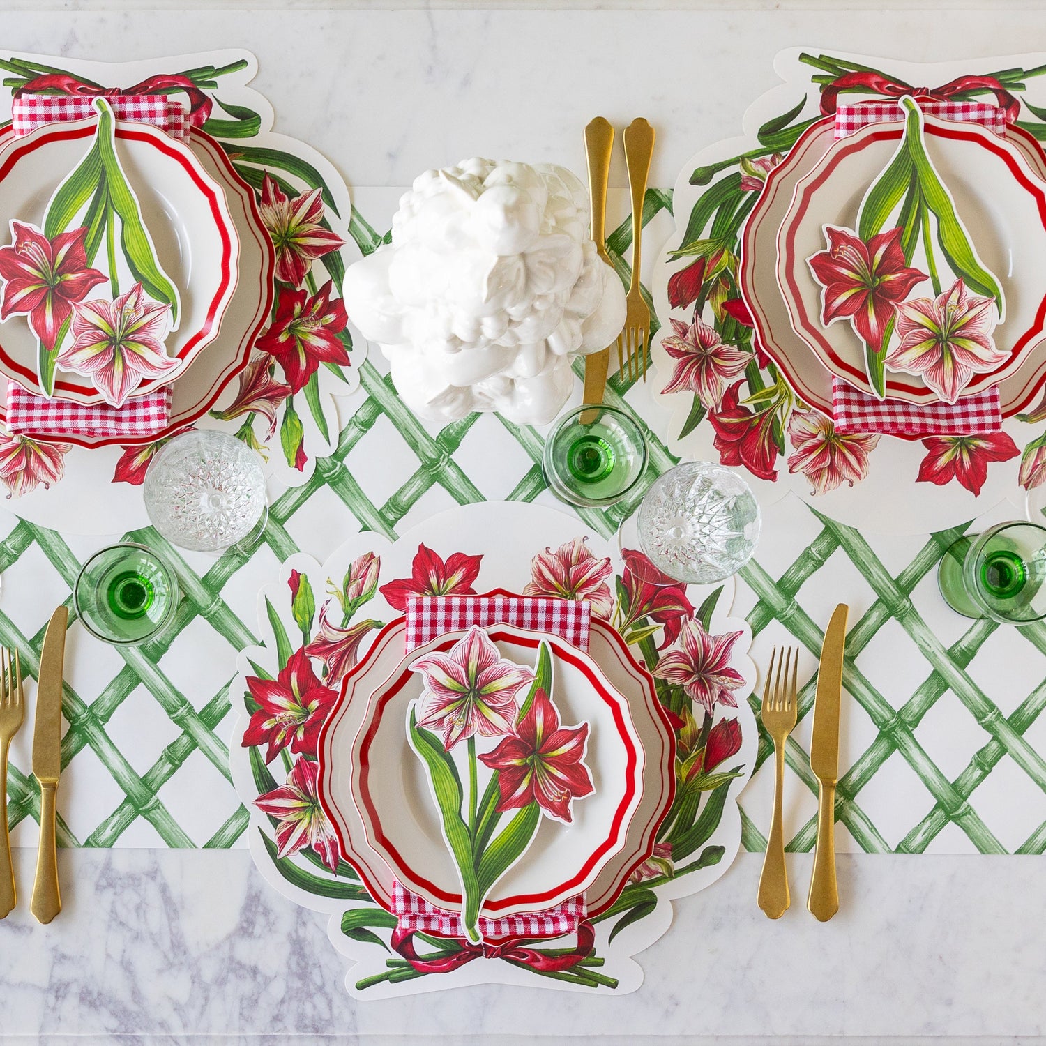 An elegant table setting featuring the Die-cut Amaryllis Placemats, Amaryllis Table Accent and Red Icing on the Cake dinnerware on the Green Lattice Runner.