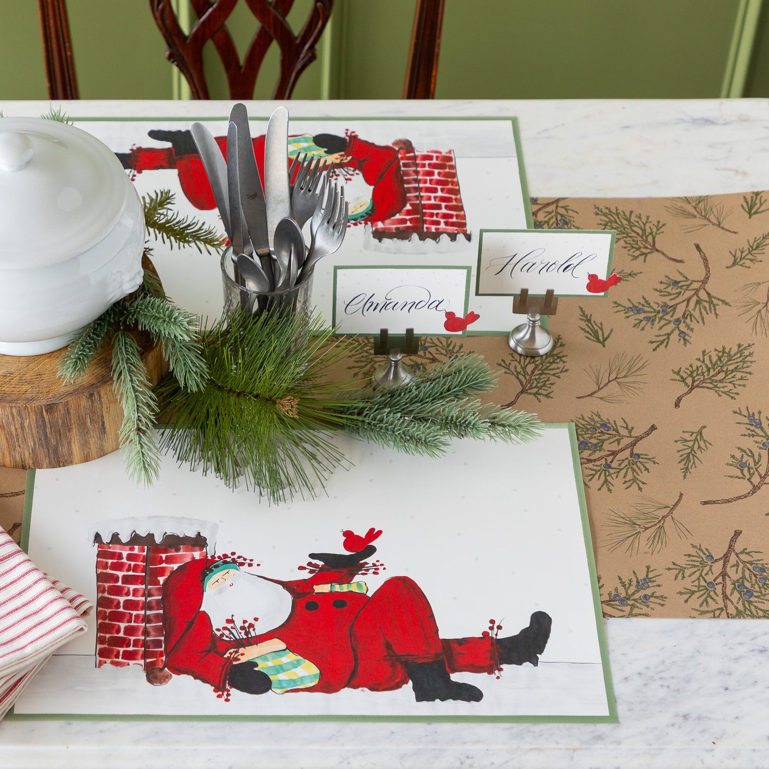 Juniper Sprigs on Kraft Runner on a Christmas themed table setting featuring Old St. Nick Chimney Placemats.