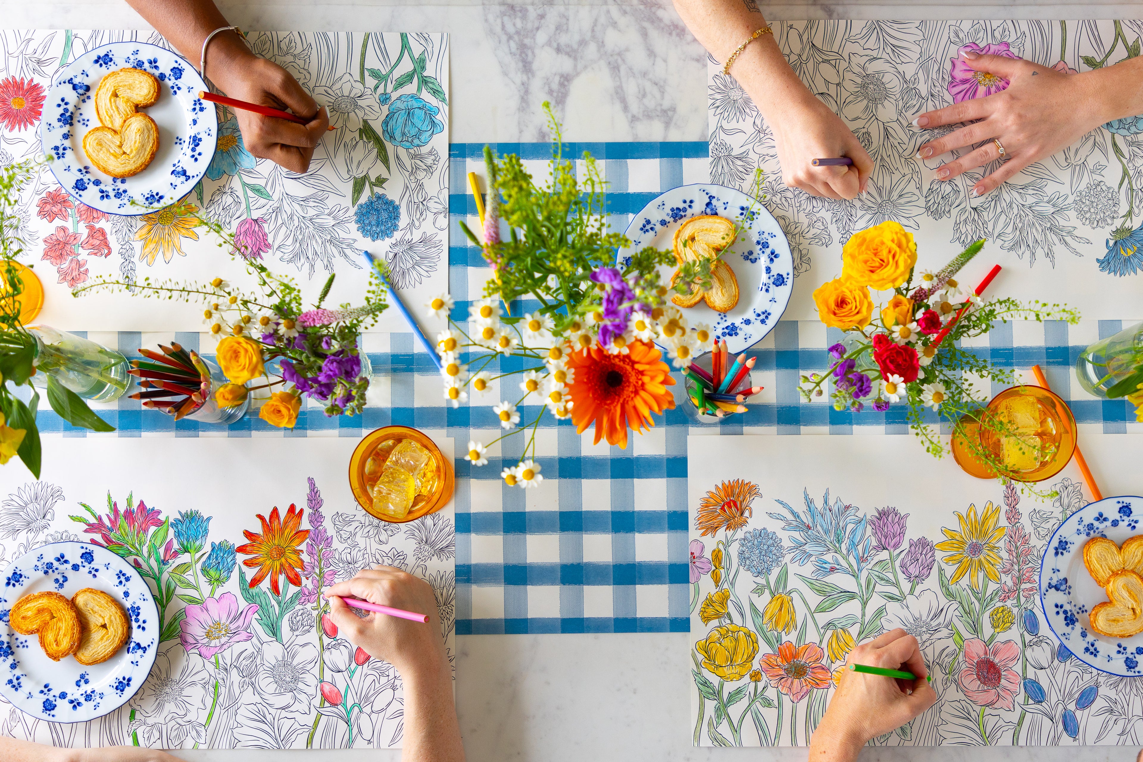 People coloring on the Coloring Wildflower Meadow Placemat.