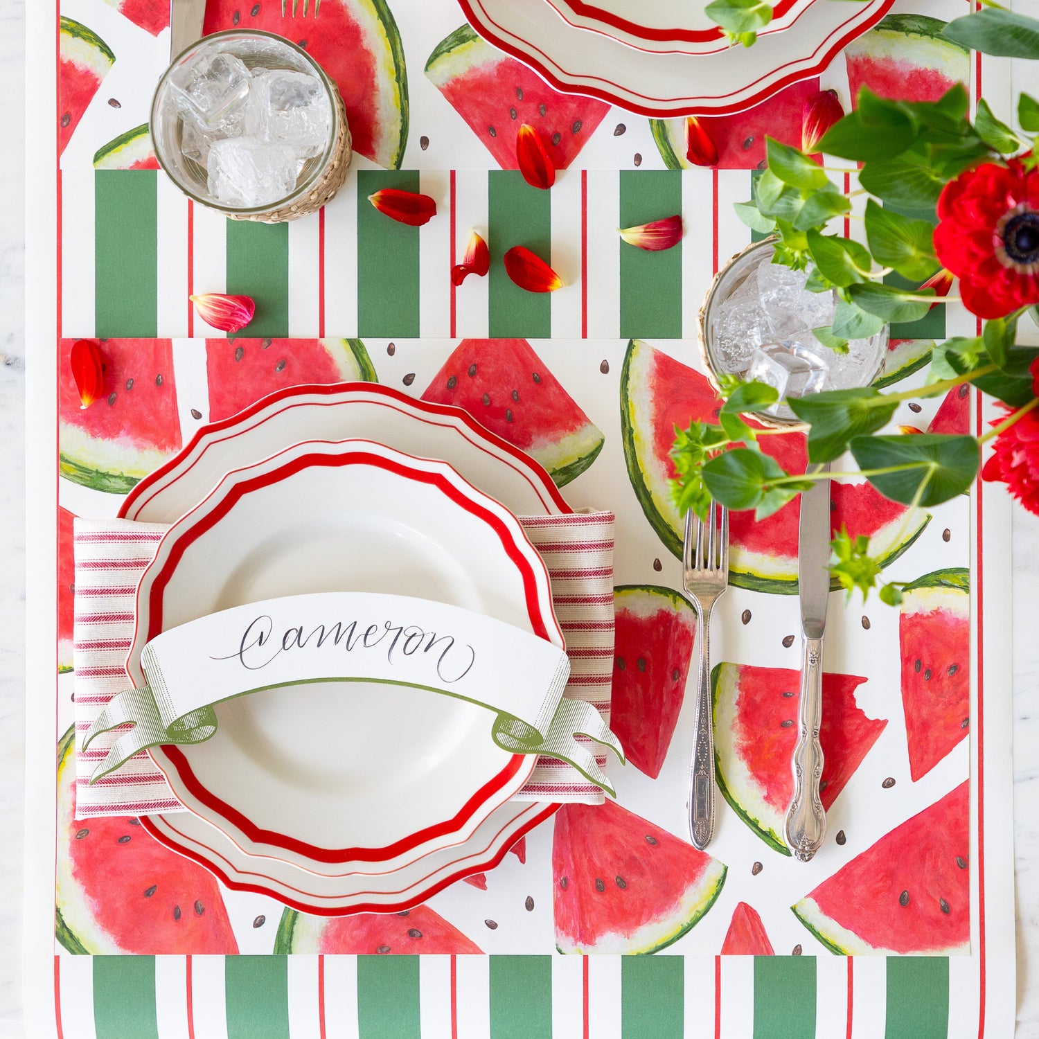 Table setting with the Watermelon Picnic Placemat, Red Icing on the Cake Dinnerware, Classic Moss Banner Table Accent and vintage flatware on the Green &amp; Red Awning Stripe Runner.