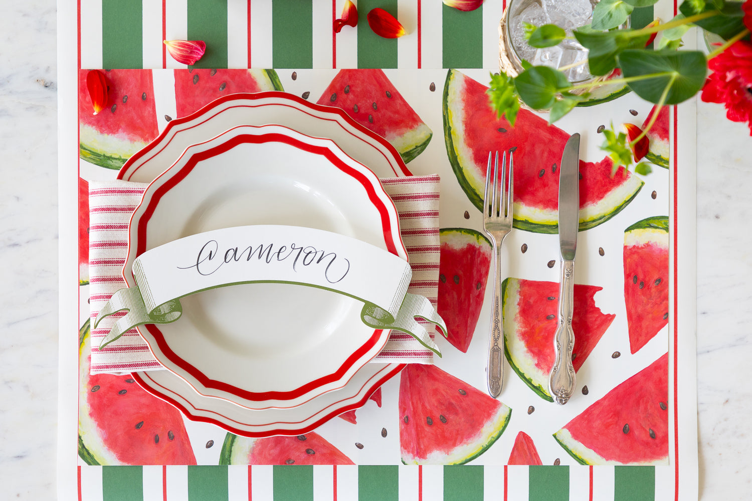 Table setting with the Watermelon Picnic Placemat, Red Icing on the Cake Dinnerware, Classic Moss Banner Table Accent and vintage flatware on the Green &amp; Red Awning Stripe Runner.