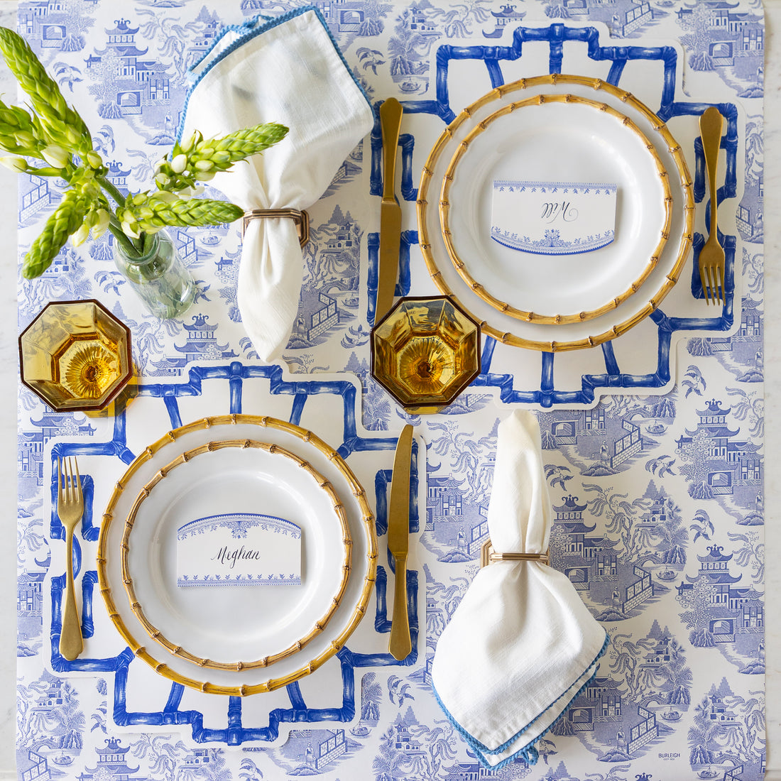 Elegant table setting with Die-cut Blue Bamboo Placemats, Juliska Bamboo plates, gold flatware, Burleigh Blue Place Cards and napkins on the Blue Regal Peacock Runner.