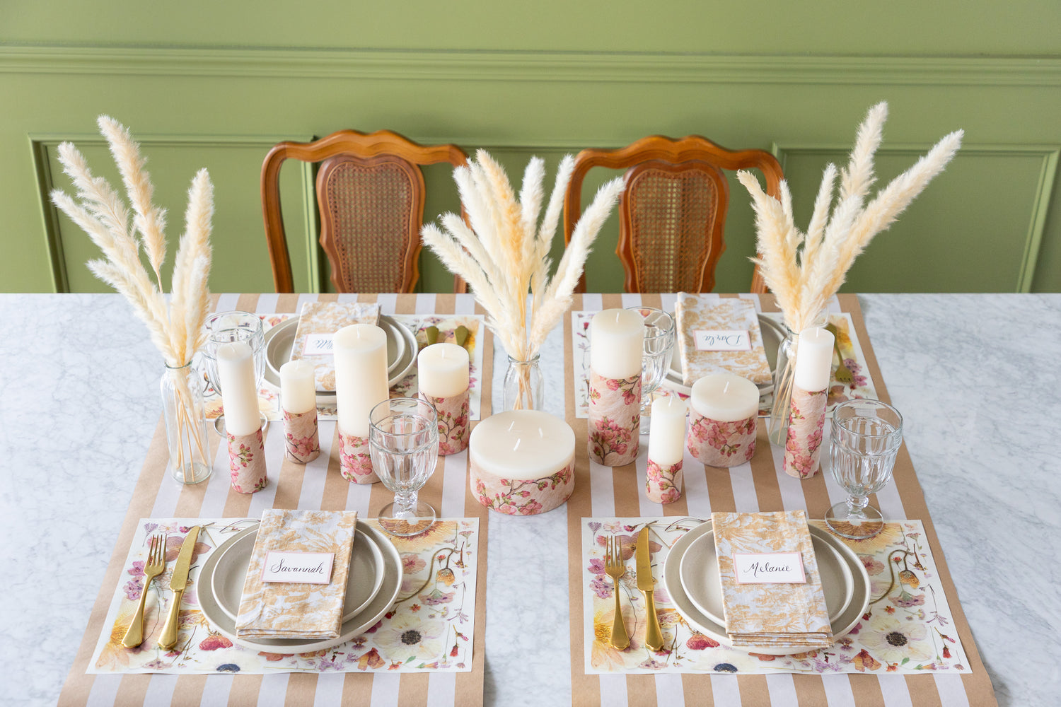 Set table with Blush Pressed Petals Placemats, cutlery, and candles on the Kraft White Classic Stripe Runner.