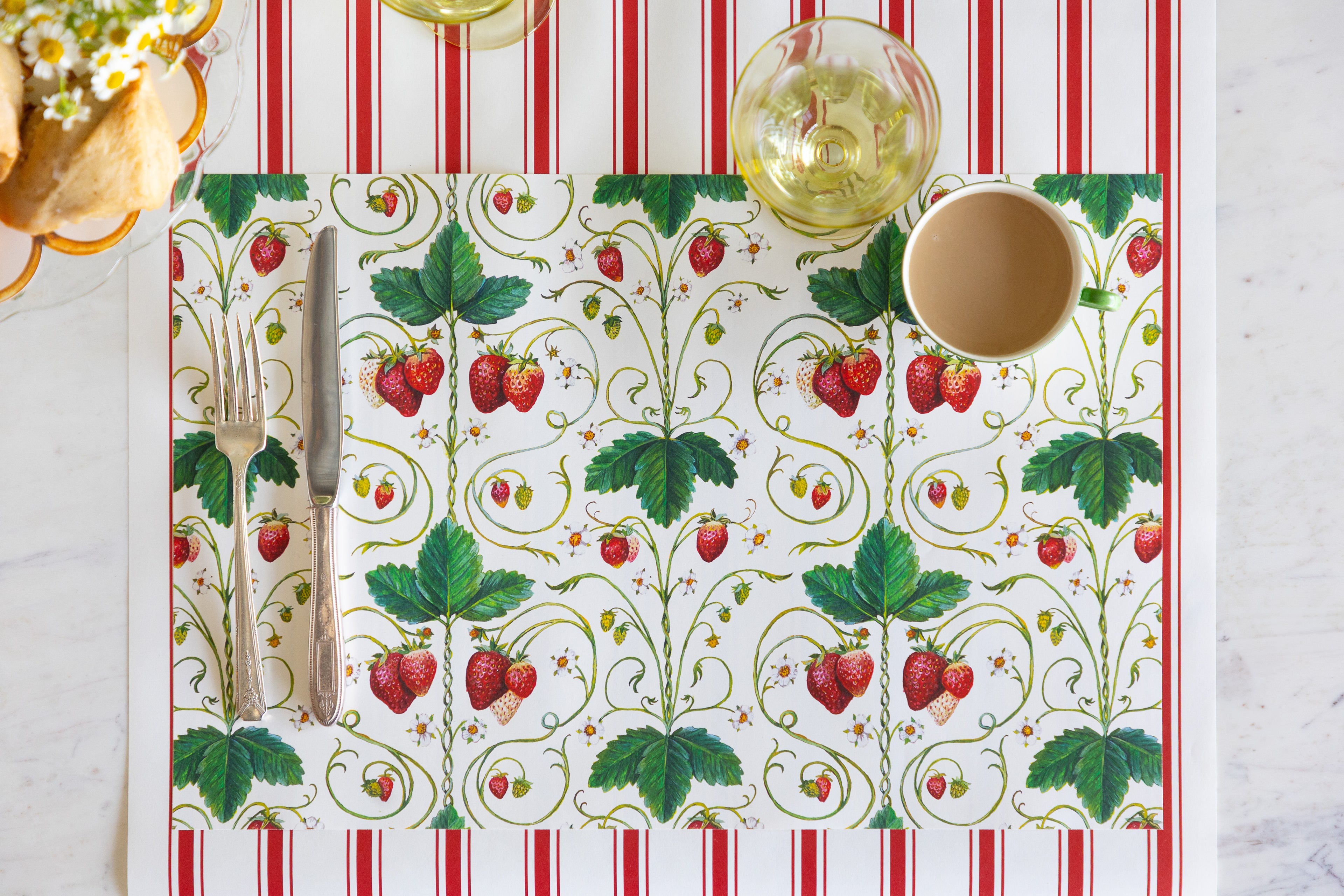 Strawberry Fields Placemat with vintage cutlery, a cup of coffee and empty glass on the Red Linen Stripe Runner.