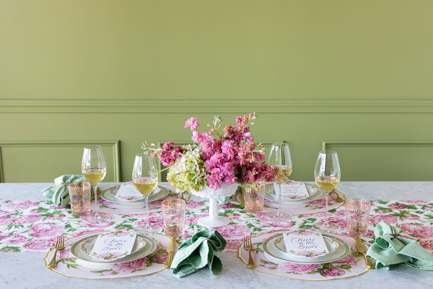 Decorative table setting with Die-cut Peony China Placemats, green rimmed and pink floral plates, vintage cutlery and flowers on the Peonies in Bloom Runner.