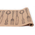 A kraft paper table runner featuring a repeating, engraving-style pattern of a fork, spoon and butter knife in black, evenly spaced down the length of the runner.