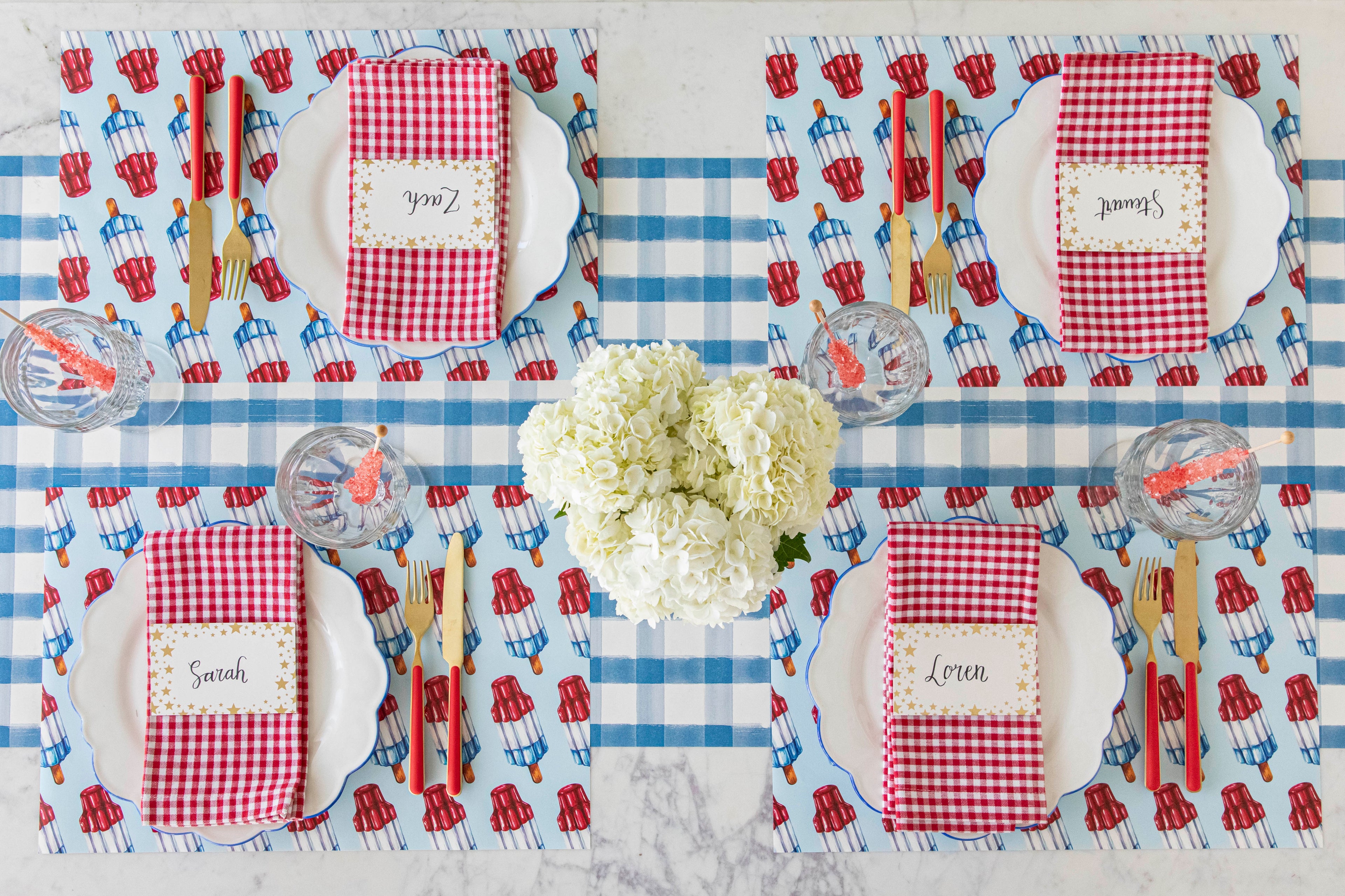 Patriotic Rocket Pop Placemats on a blue plaid paper table runner with 4th of July table inspiration.