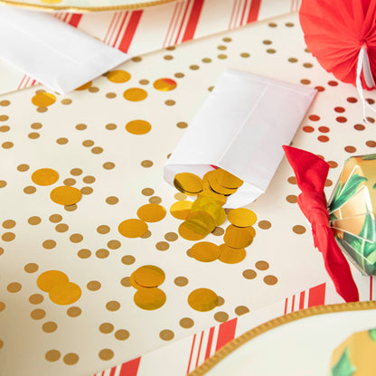 A close up of the Gold Confetti Runner with gold confetti pieces sprinkled out of an enevelope.