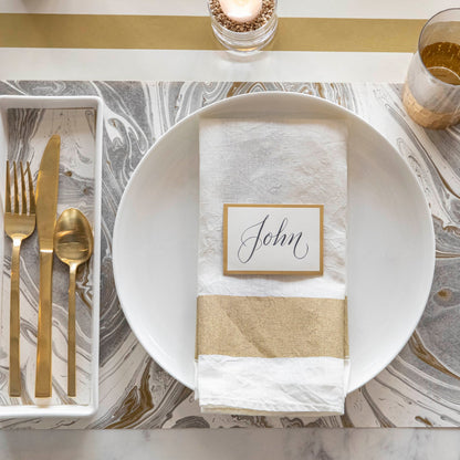 Gold Classic Stripe Runner under a marble placemat and place setting.