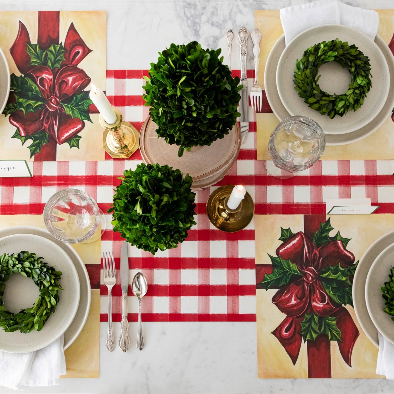 The Red Painted Check Runner on a festive table setting for four, under the Christmas Present Placemat.