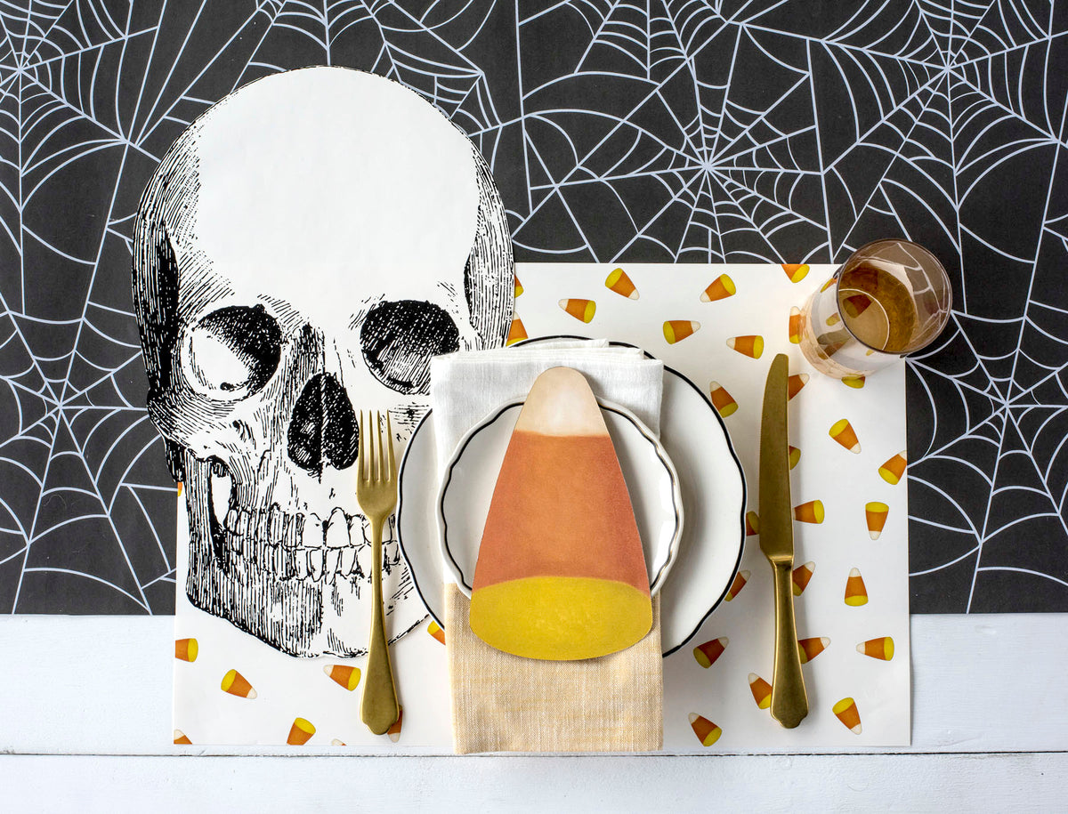 The Candy Corn Placemat under a Halloween-themed place setting.