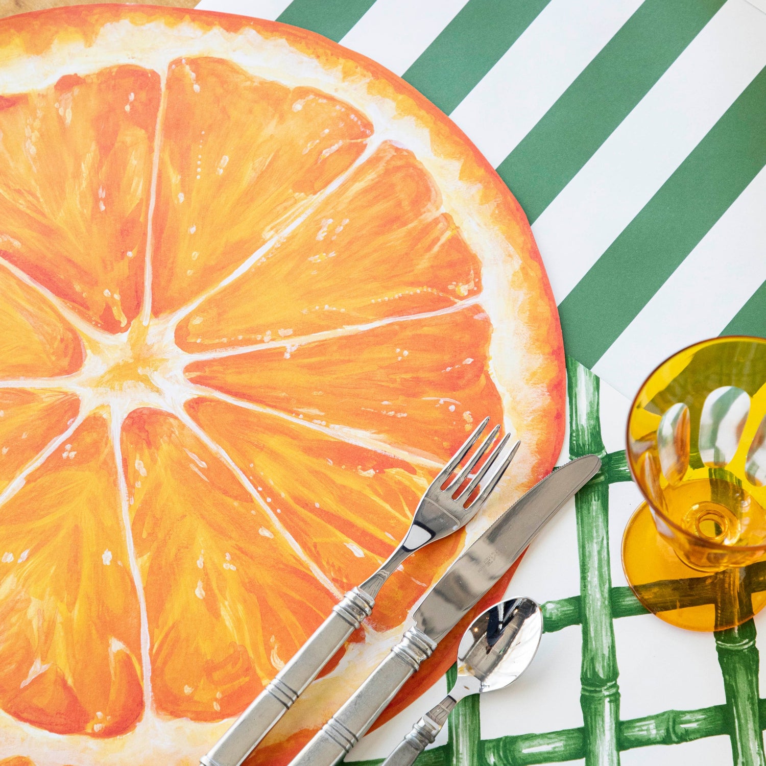 Dark Green Classic Stripe Runner under a citrus place setting.