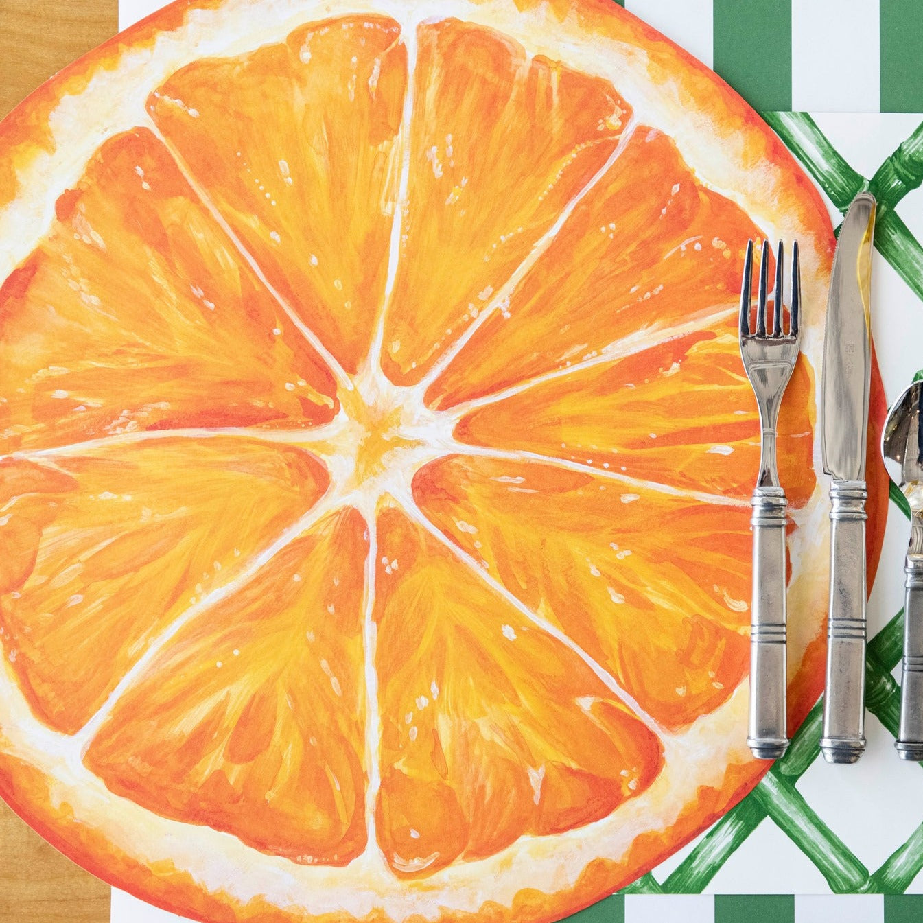 The Die-cut Orange Slice in an elegant place setting sans plate, from above.