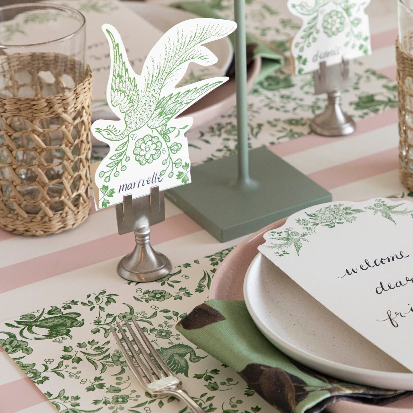 An ornamental Green Regal Peacock Placemat pattern featuring green and white colors with flowers, perfect for eco-conscious individuals as it is made from recycled content.