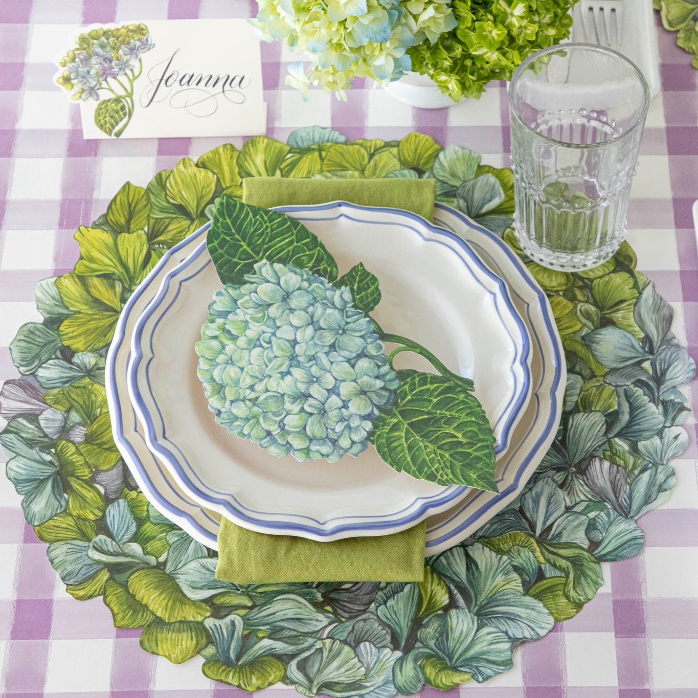 Die-cut Hydrangea Placemat under an elegant place setting for one.