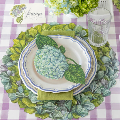 Die-cut Hydrangea Placemat under an elegant place setting for one.