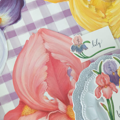 A handmade tablescape featuring a group of Hester &amp; Cook Die-cut Iris Placemats on a white background.