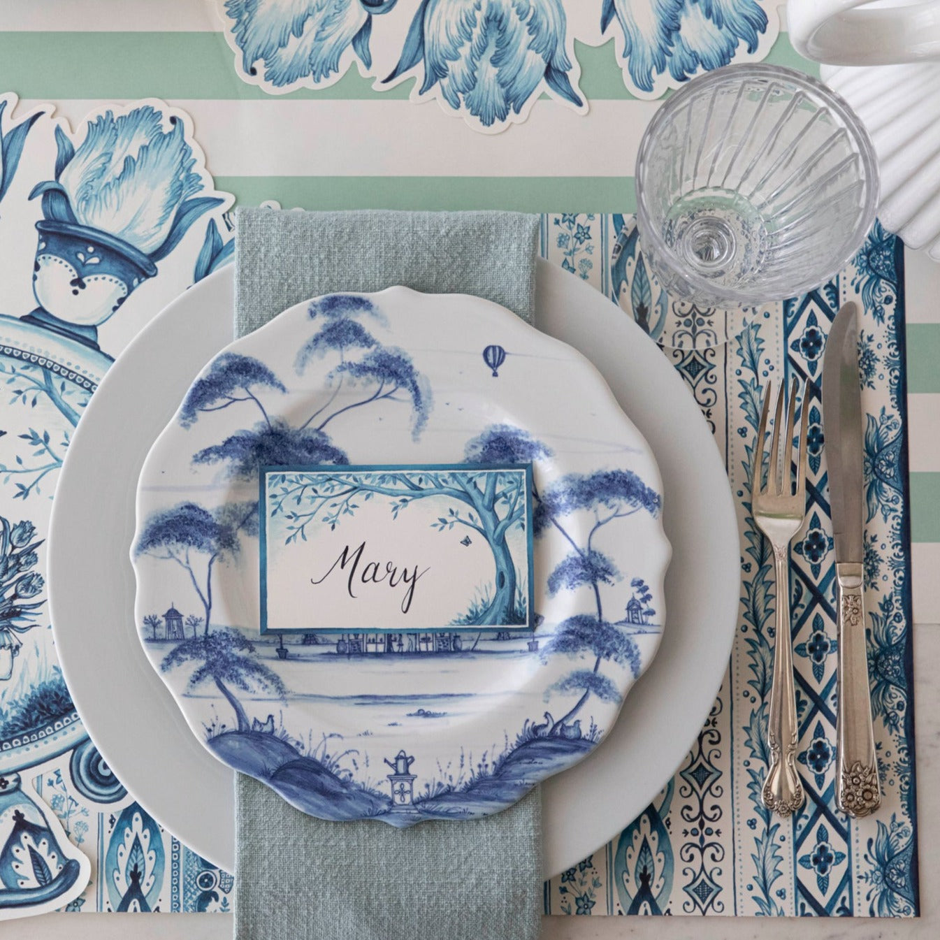 The Indigo Chintz Placemat under an elegant place setting, from above.