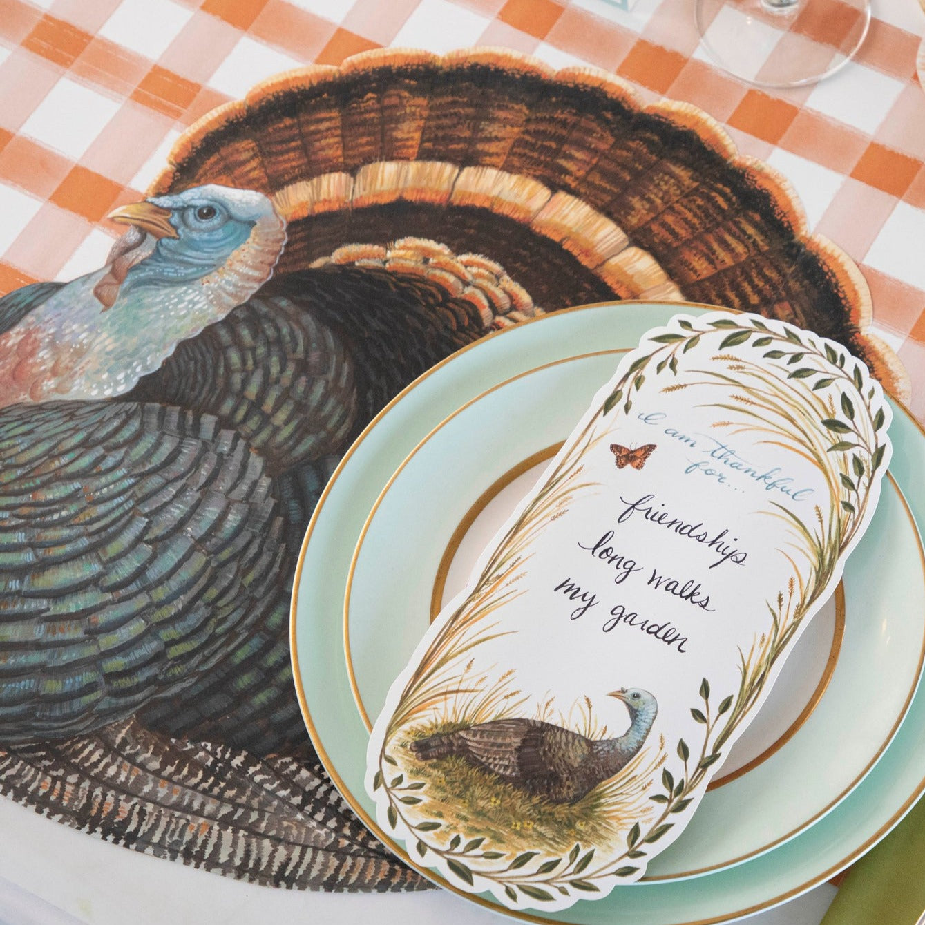 The Die-cut Heritage Turkey Placemat under an elegant Thanksgiving place setting.