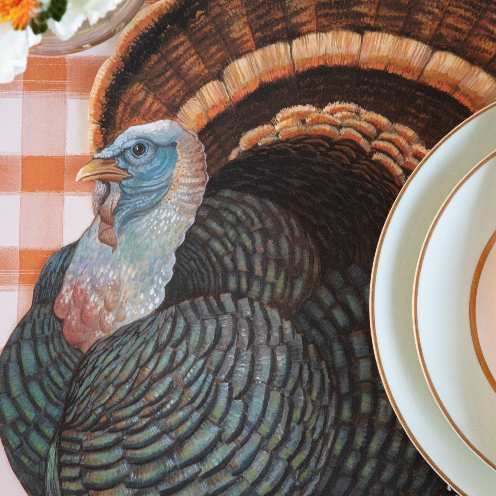 Close-up of the Die-cut Heritage Turkey Placemat under an elegant Thanksgiving place setting, showing the vibrant artwork in detail.