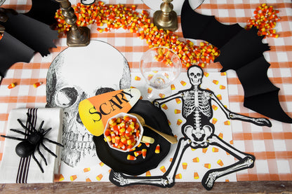 The Candy Corn Placemat under a fun Halloween-themed place setting.