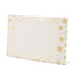 A white, rectangular freestanding place card featuring a scatter of different sized gold foil stars framing the edges.