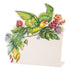 A die-cut freestanding place card featuring a vibrant parrot surrounded by tropical foliage adorning the top and left edges of the card, with an open white area in the lower right for personalization.