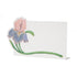 A white, rectangular freestanding place card featuring a pink and purple iris blossom on a long green stem, adorning the left and lower edges of the card.
