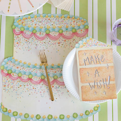 The Die-cut Birthday Cake Placemat under a birthday place setting, from above.